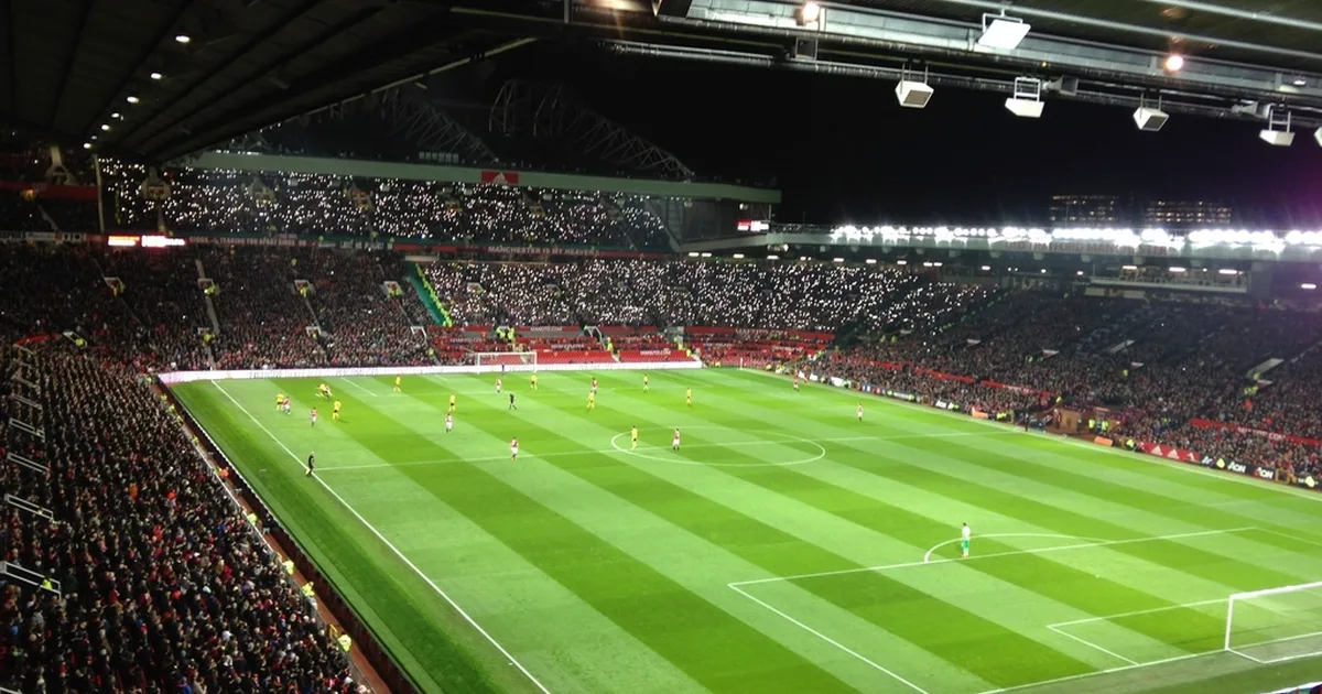 Professional football editorial header image, empty iconic European football stadium at go