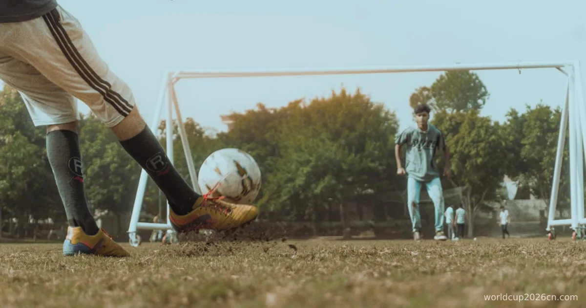 man in white shirt and brown pants playing soccer during daytime