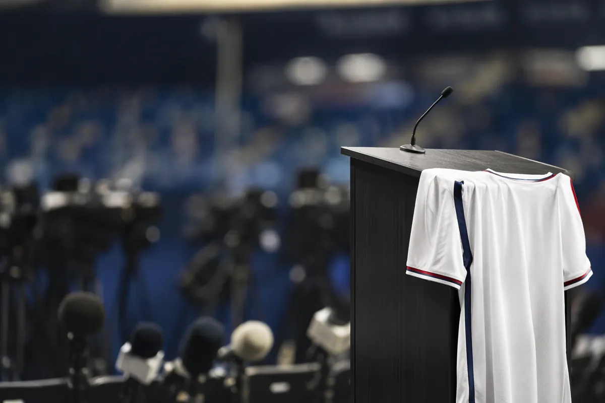 Professional football press conference setup, empty podium with a generic national team je