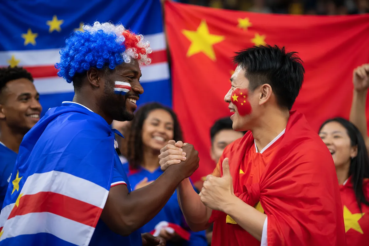 Warm interaction scene between football fans of different nationalities, blurred Cape Verd