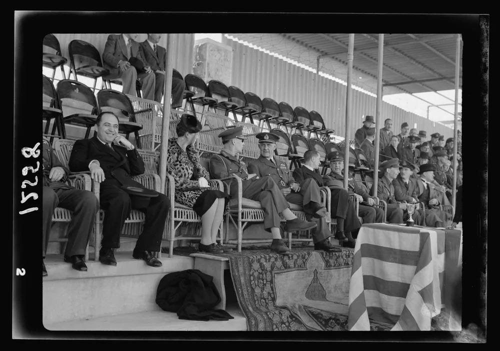 Medium shot of a group of female football fans discussing match tactics while wa