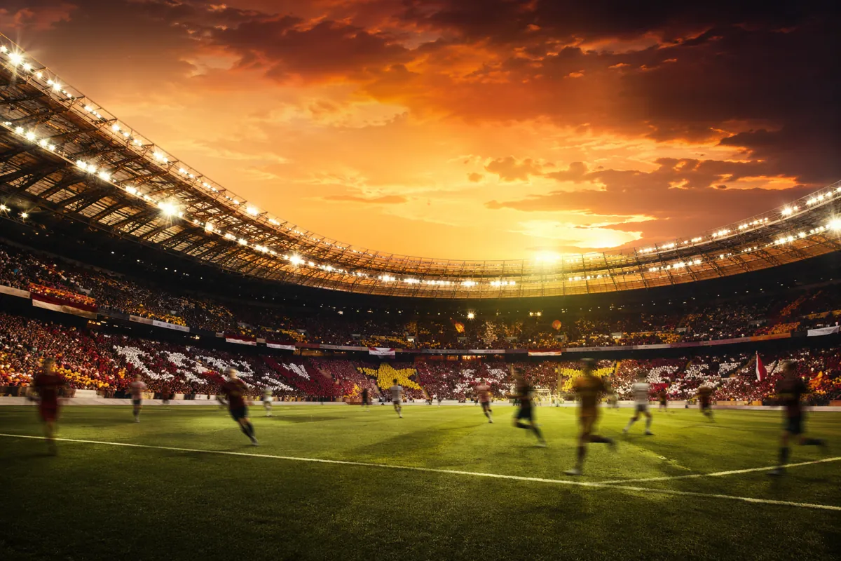 Professional football news header image, wide angle shot of a large modern football stadiu